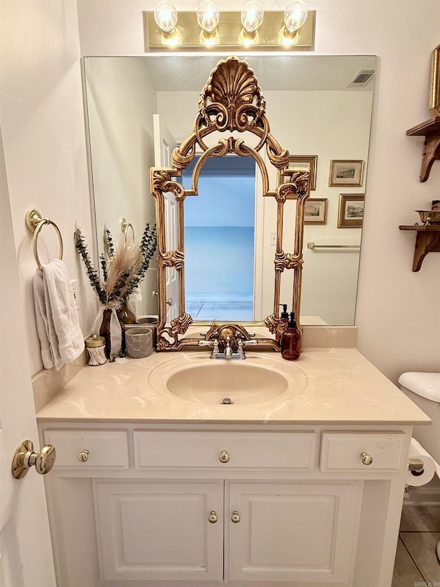 7 Butterfly Dr, Sherwood, AR 72120 - bathroom with vanity, toilet, and tile patterned flooring
