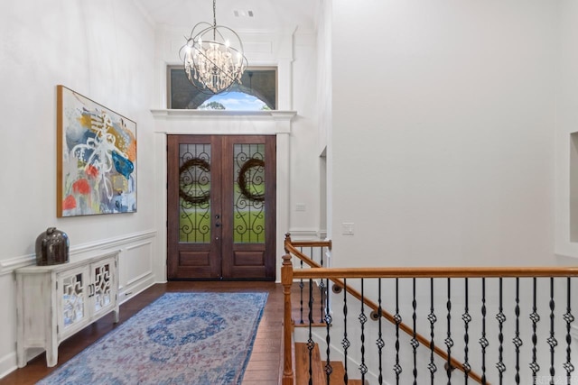 1517 Wetherborne Dr, Little Rock, AR 72211 - foyer with a chandelier, wood finished floors, and a high ceiling