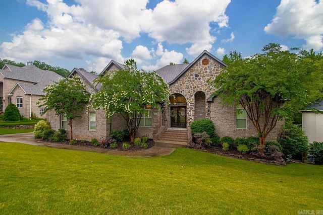 1517 Wetherborne Dr, Little Rock, AR 72211 - view of front of home with stone siding, french doors, and a front lawn