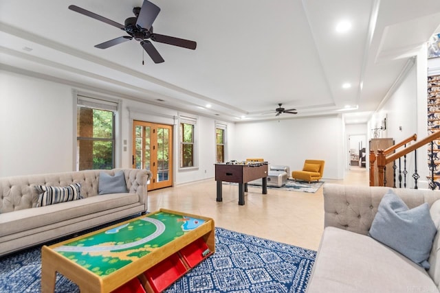 1517 Wetherborne Dr, Little Rock, AR 72211 - living room with a tray ceiling, ceiling fan, recessed lighting, stairs, and light tile patterned floors