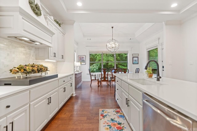 1517 Wetherborne Dr, Little Rock, AR 72211 - kitchen with a sink, dishwasher, a tray ceiling, a chandelier, and healthy amount of natural light