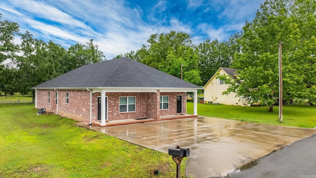 1 Park St Unit A & B, Mayflower, AR 72106 - rear view of property with brick siding, a patio, a lawn, roof with shingles, and central AC
