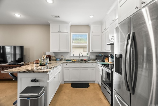 1 Park St Unit A & B, Mayflower, AR 72106 - kitchen featuring appliances with stainless steel finishes, a sink, a peninsula, concrete flooring, and backsplash