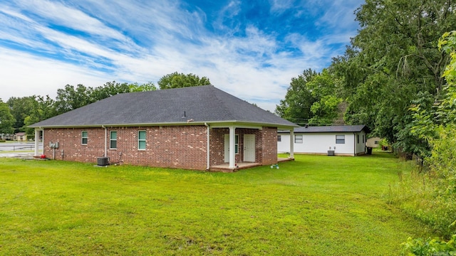 1 Park St Unit A & B, Mayflower, AR 72106 - back of house with a yard, brick siding, and central AC