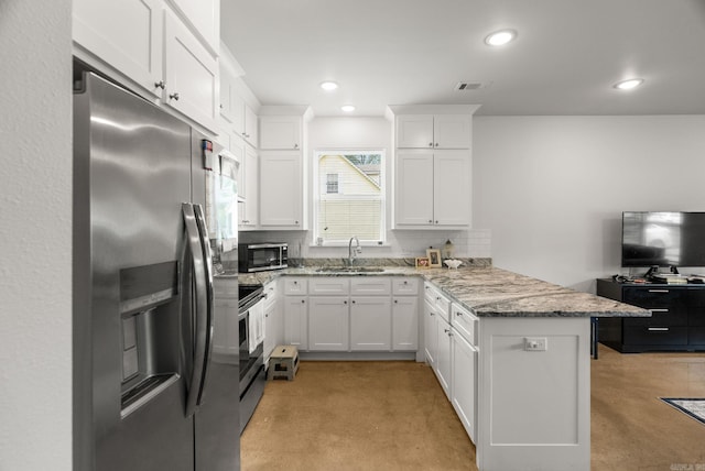 1 Park St Unit A & B, Mayflower, AR 72106 - kitchen with stainless steel appliances, a peninsula, a sink, concrete floors, and tasteful backsplash