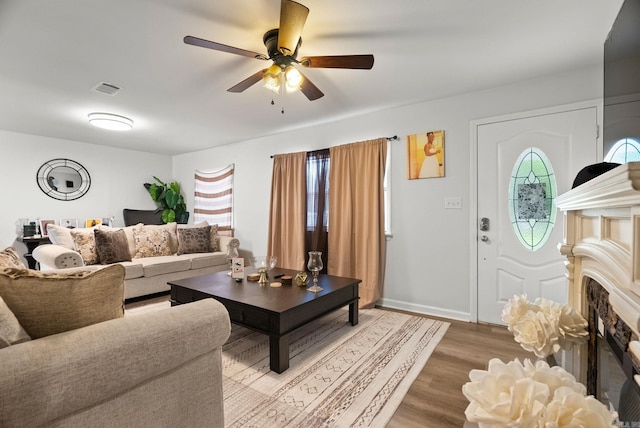 30 Center St Unit A & B, Mayflower, AR 72106 - living room with ceiling fan, light wood-style flooring, a fireplace, and baseboards
