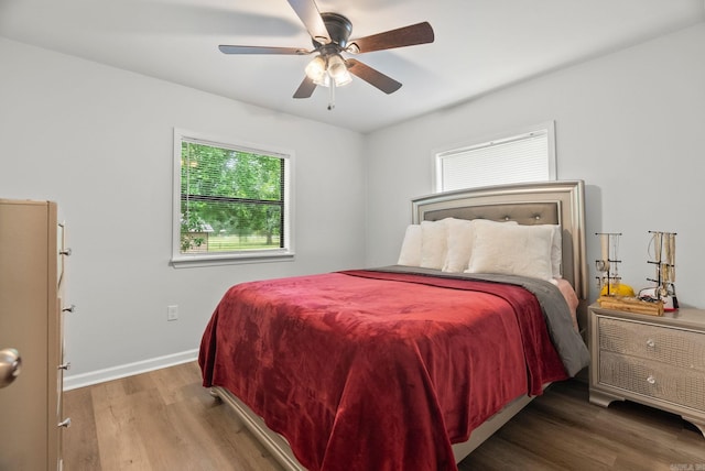 30 Center St Unit A & B, Mayflower, AR 72106 - bedroom with multiple windows, wood finished floors, baseboards, and ceiling fan