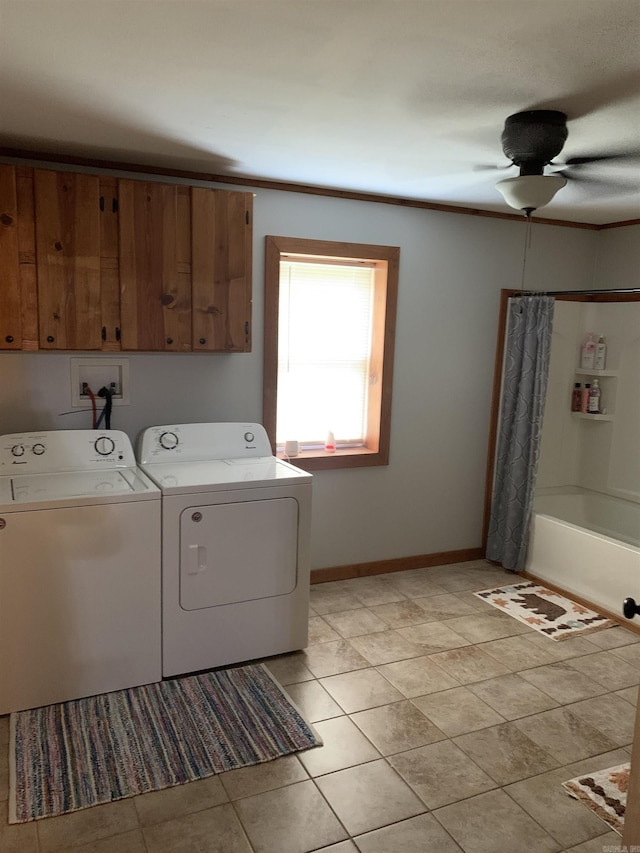 160 Ouachita 476, Camden, AR 71701 - laundry area featuring washer and clothes dryer, baseboards, cabinet space, and light tile patterned floors