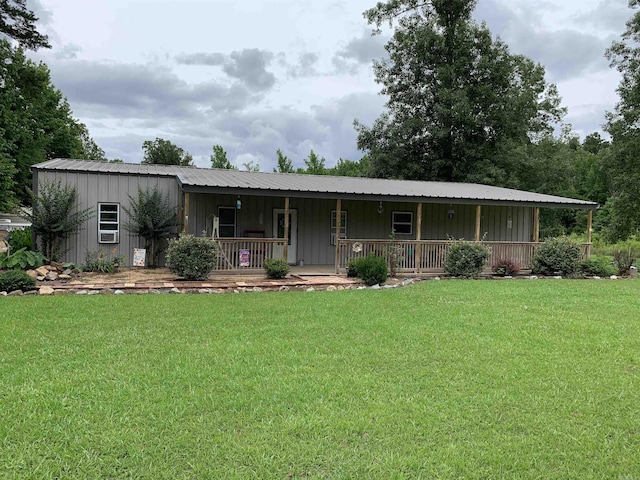 160 Ouachita 476, Camden, AR 71701 - view of front facade featuring covered porch, a front lawn, board and batten siding, and metal roof
