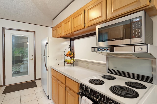 23 Valls Ln, Hot Springs, AR 71909 - kitchen featuring stainless steel microwave, electric range, light countertops, light tile patterned floors, and a textured ceiling