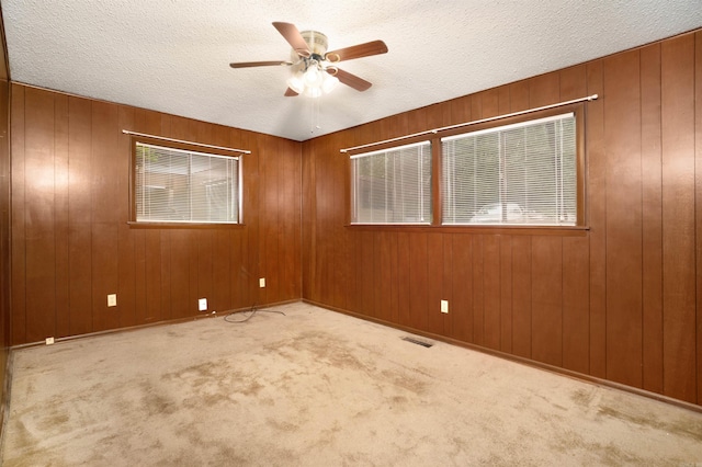 23 Valls Ln, Hot Springs, AR 71909 - carpeted spare room with ceiling fan, a textured ceiling, and wood walls