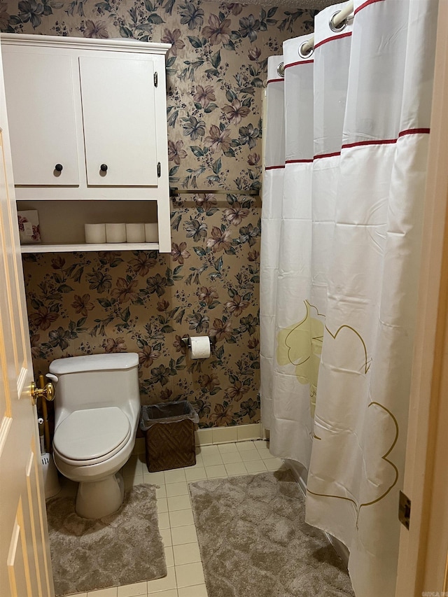 17003 Quail Run Dr, Little Rock, AR 72210 - full bathroom with tile patterned floors, wallpapered walls, toilet, baseboards, and curtained shower