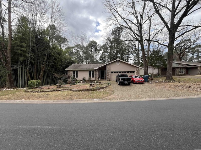 17003 Quail Run Dr, Little Rock, AR 72210 - view of front of home with an attached garage, driveway, and brick siding