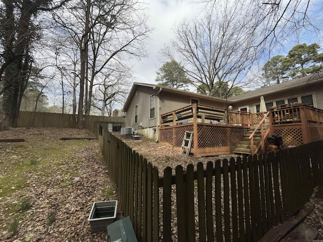 17003 Quail Run Dr, Little Rock, AR 72210 - back of house featuring a fenced backyard, a wooden deck, cooling unit, and stairway