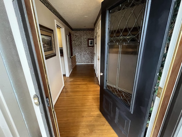 17003 Quail Run Dr, Little Rock, AR 72210 - hall with wallpapered walls, light wood-type flooring, crown molding, and baseboards
