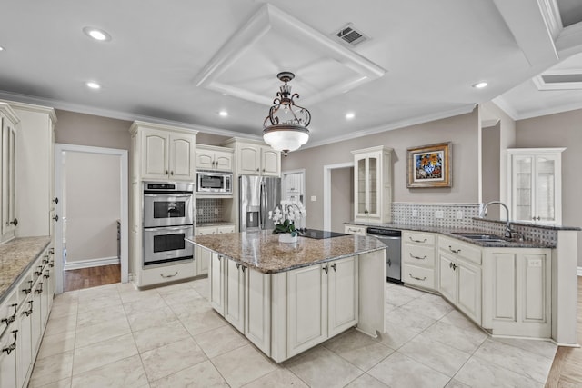 119 Marseille Dr, Maumelle, AR 72113 - kitchen with stainless steel appliances, a sink, a kitchen island, a peninsula, and recessed lighting