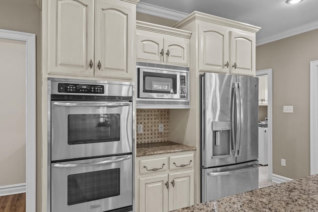 119 Marseille Dr, Maumelle, AR 72113 - kitchen featuring stainless steel appliances, stone counters, decorative backsplash, baseboards, and crown molding