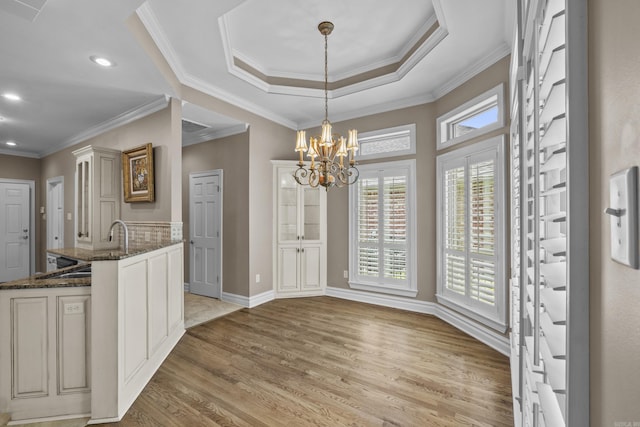 119 Marseille Dr, Maumelle, AR 72113 - unfurnished dining area with light wood-type flooring, a chandelier, recessed lighting, baseboards, and crown molding