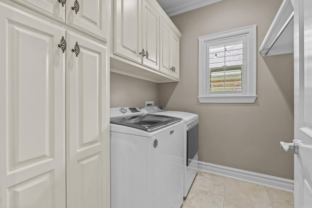 119 Marseille Dr, Maumelle, AR 72113 - laundry room with washing machine and clothes dryer, cabinet space, baseboards, and light tile patterned floors