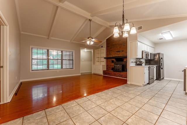 1655 Doe Trl, Conway, AR 72034 - kitchen with stainless steel appliances, ceiling fan, light wood-style floors, white cabinets, and light countertops