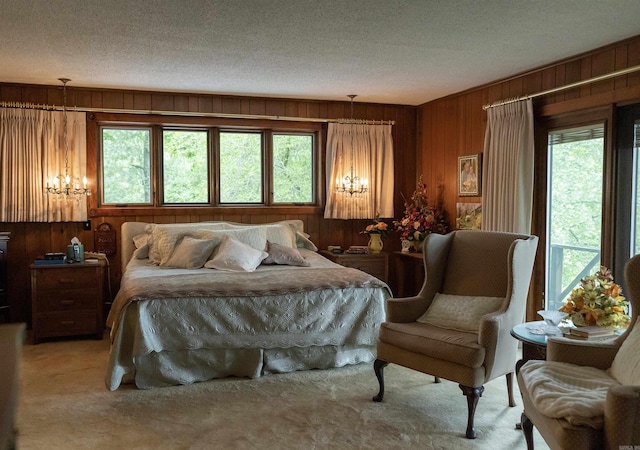 100 Rainbow Loop, Heber Springs, AR 72543 - bedroom featuring wooden walls, multiple windows, carpet flooring, and a textured ceiling