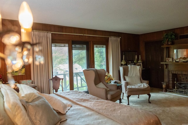 100 Rainbow Loop, Heber Springs, AR 72543 - bedroom with wood walls, a textured ceiling, carpet, and a fireplace