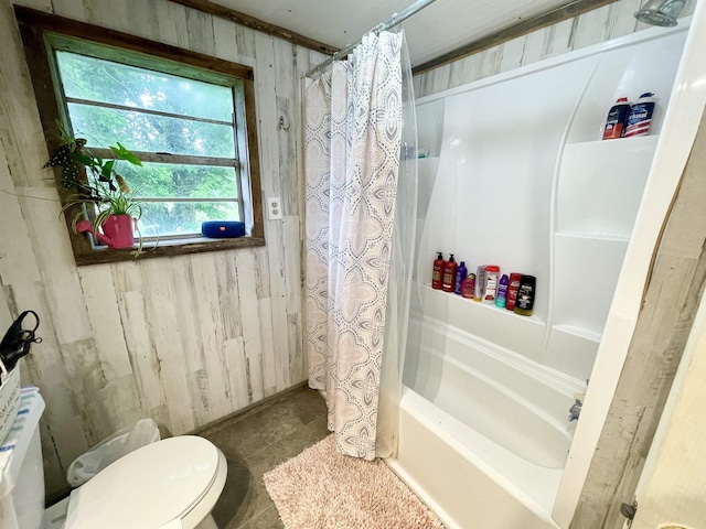 11 Fruitwood Ln, Glencoe, AR 72539 - full bathroom featuring wood walls, shower / bath combo with shower curtain, toilet, and tile patterned floors