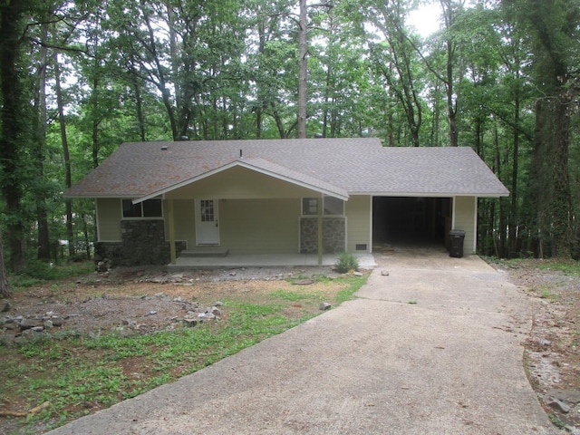13 Cevico Ln, Hot Springs Village, AR 71909 - view of front facade with asphalt driveway, a shingled roof, and covered porch