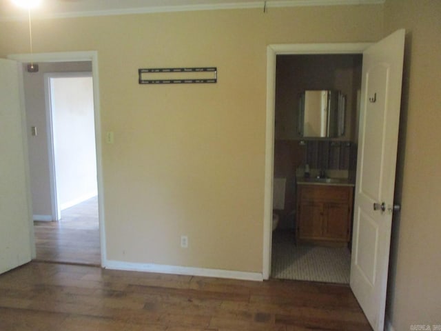 3908 S Hazel St, Pine Bluff, AR 71603 - empty room featuring wood finished floors, baseboards, and ornamental molding