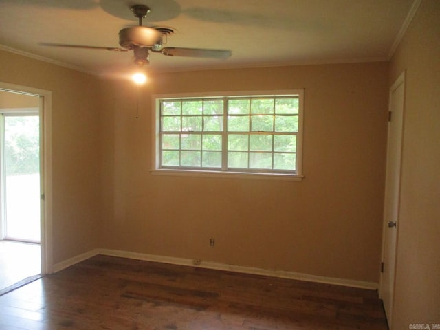 3908 S Hazel St, Pine Bluff, AR 71603 - spare room with crown molding, ceiling fan, dark wood finished floors, and baseboards
