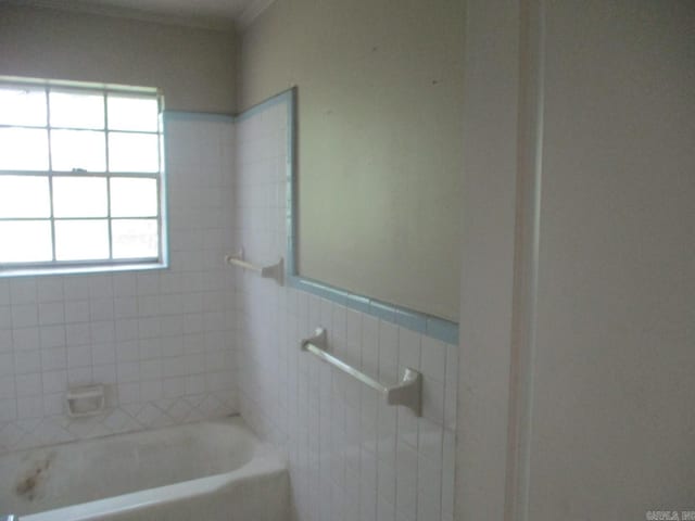 3908 S Hazel St, Pine Bluff, AR 71603 - full bath with a tub to relax in, ornamental molding, and tile walls