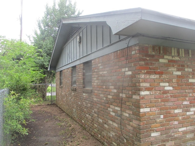 3908 S Hazel St, Pine Bluff, AR 71603 - view of side of property featuring board and batten siding and brick siding