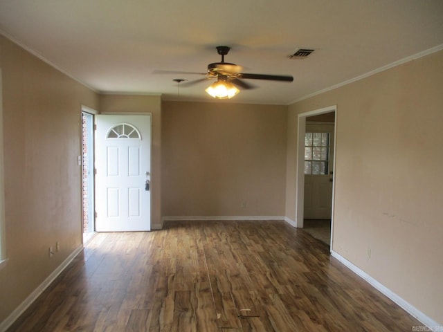 3908 S Hazel St, Pine Bluff, AR 71603 - unfurnished room with crown molding, ceiling fan, dark wood-type flooring, and baseboards