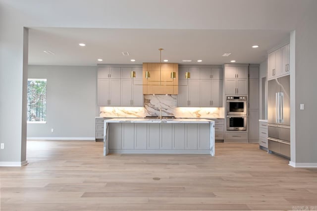 22 Abington Ct, Little Rock, AR 72223 - kitchen with double oven, gray cabinetry, decorative backsplash, a sink, and baseboards