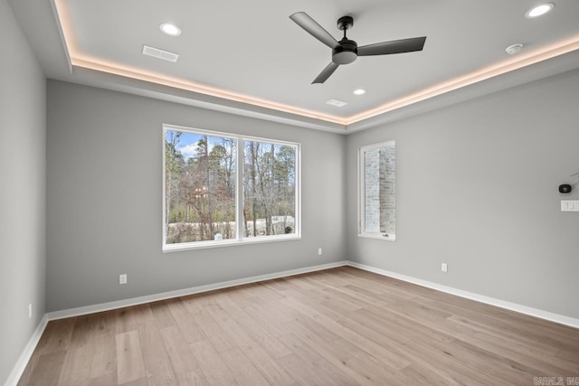 22 Abington Ct, Little Rock, AR 72223 - empty room featuring a raised ceiling, wood finished floors, a ceiling fan, recessed lighting, and a smoke detector