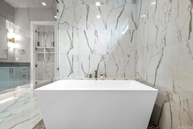 22 Abington Ct, Little Rock, AR 72223 - bathroom featuring tile walls and a freestanding tub