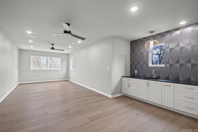 22 Abington Ct, Little Rock, AR 72223 - indoor wet bar with recessed lighting, light wood-style floors, decorative backsplash, a ceiling fan, and baseboards