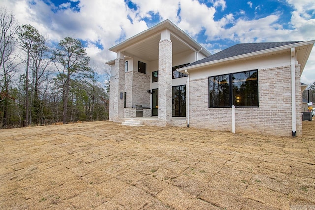 22 Abington Ct, Little Rock, AR 72223 - back of property with a balcony and brick siding