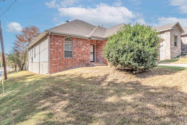 2820 Zion St, Little Rock, AR 72204 - rear view of house featuring brick siding, a yard, and roof with shingles