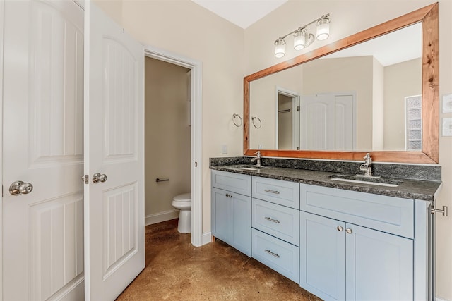 2820 Zion St, Little Rock, AR 72204 - full bath with concrete flooring, double vanity, toilet, and baseboards