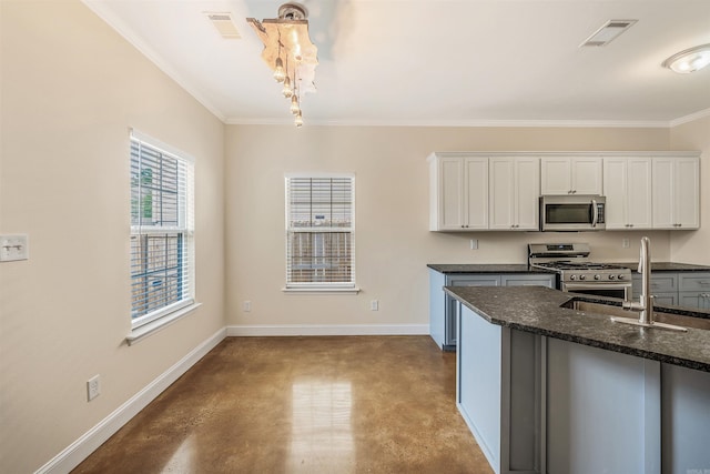2820 Zion St, Little Rock, AR 72204 - kitchen with appliances with stainless steel finishes, finished concrete flooring, white cabinets, a sink, and crown molding