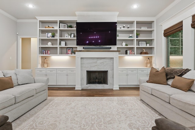 1045 Boulder Dr, Little Rock, AR 72210 - living area featuring ornamental molding, wood finished floors, a tile fireplace, and recessed lighting