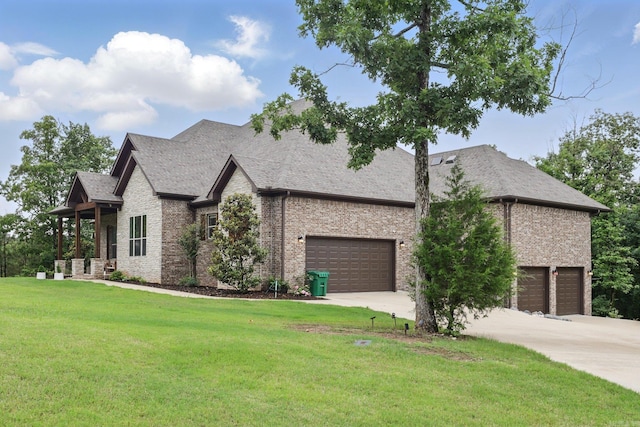 1045 Boulder Dr, Little Rock, AR 72210 - view of front of property with a front lawn, brick siding, a garage, and concrete driveway