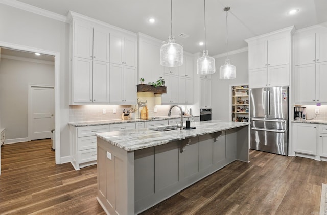 1045 Boulder Dr, Little Rock, AR 72210 - kitchen with appliances with stainless steel finishes, a sink, ornamental molding, tasteful backsplash, and recessed lighting
