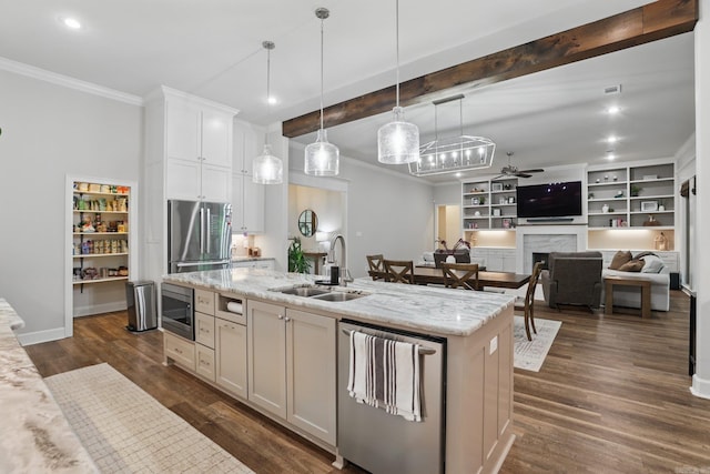 1045 Boulder Dr, Little Rock, AR 72210 - kitchen featuring a sink, stainless steel appliances, ornamental molding, ceiling fan, and hanging light fixtures