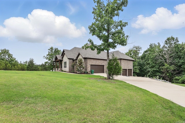 1045 Boulder Dr, Little Rock, AR 72210 - view of front of home with driveway, a front yard, a garage, and brick siding