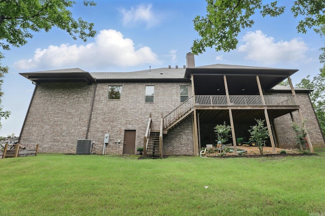 1045 Boulder Dr, Little Rock, AR 72210 - rear view of house featuring stairs, a lawn, central air condition unit, and a chimney