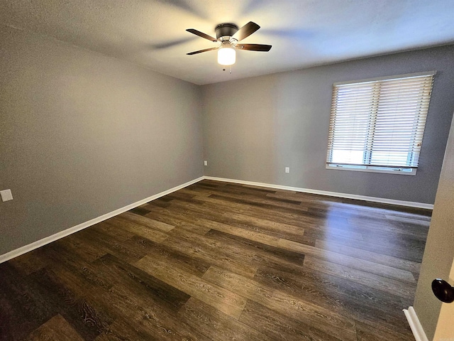 2715 Greenbriar Dr Apt B, Jonesboro, AR 72401 - unfurnished room featuring dark wood-style floors, a ceiling fan, and baseboards