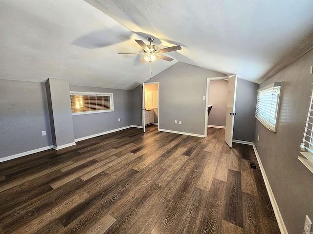 2715 Greenbriar Dr Apt B, Jonesboro, AR 72401 - unfurnished living room with ceiling fan, dark wood finished floors, lofted ceiling, and baseboards