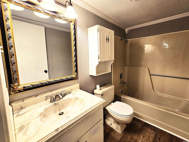 2715 Greenbriar Dr Apt B, Jonesboro, AR 72401 - bathroom with wood finished floors, ornamental molding, vanity, tub / shower combination, and toilet